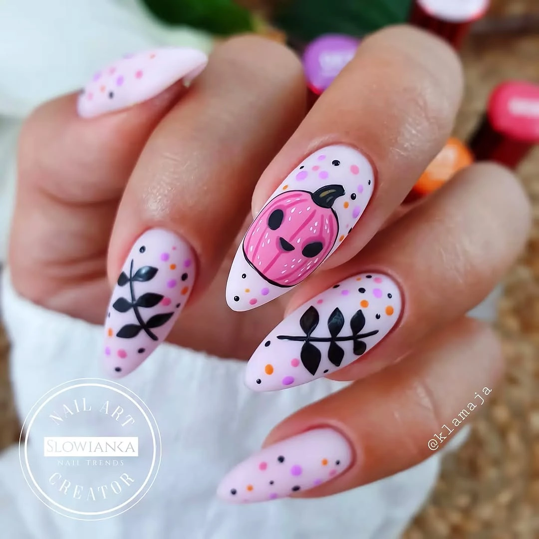 Pastel almond nails with pink ghost and playful dotted details