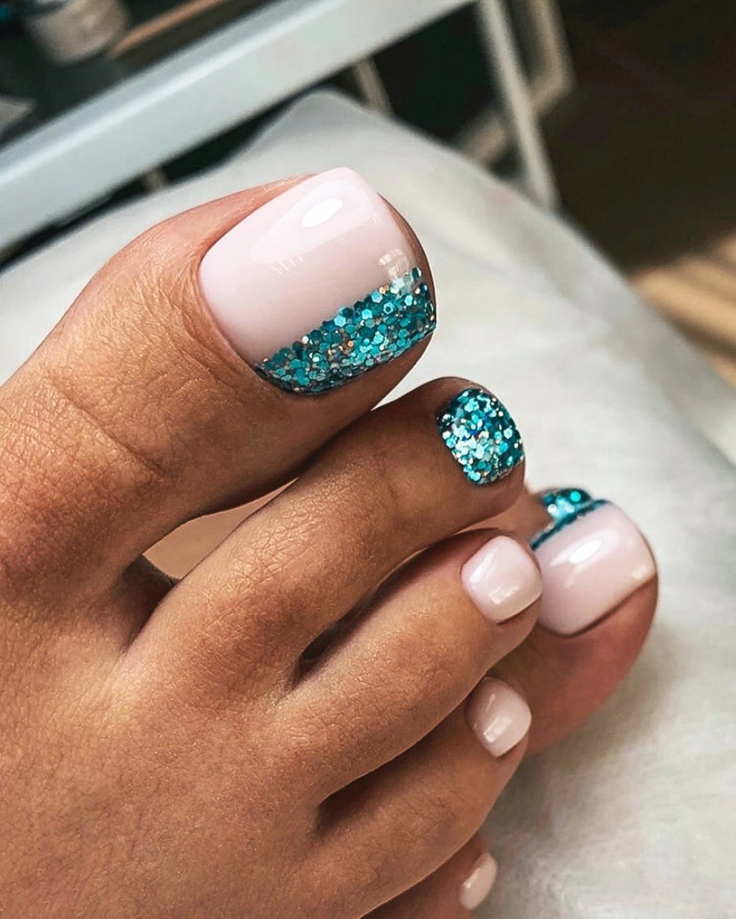 Teal glitter French tip pedicure