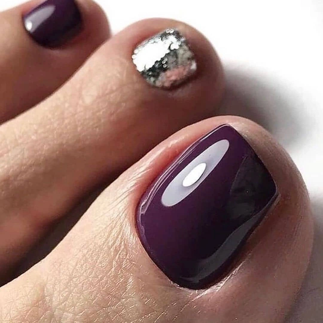 Deep plum pedicure with smoky silver accent