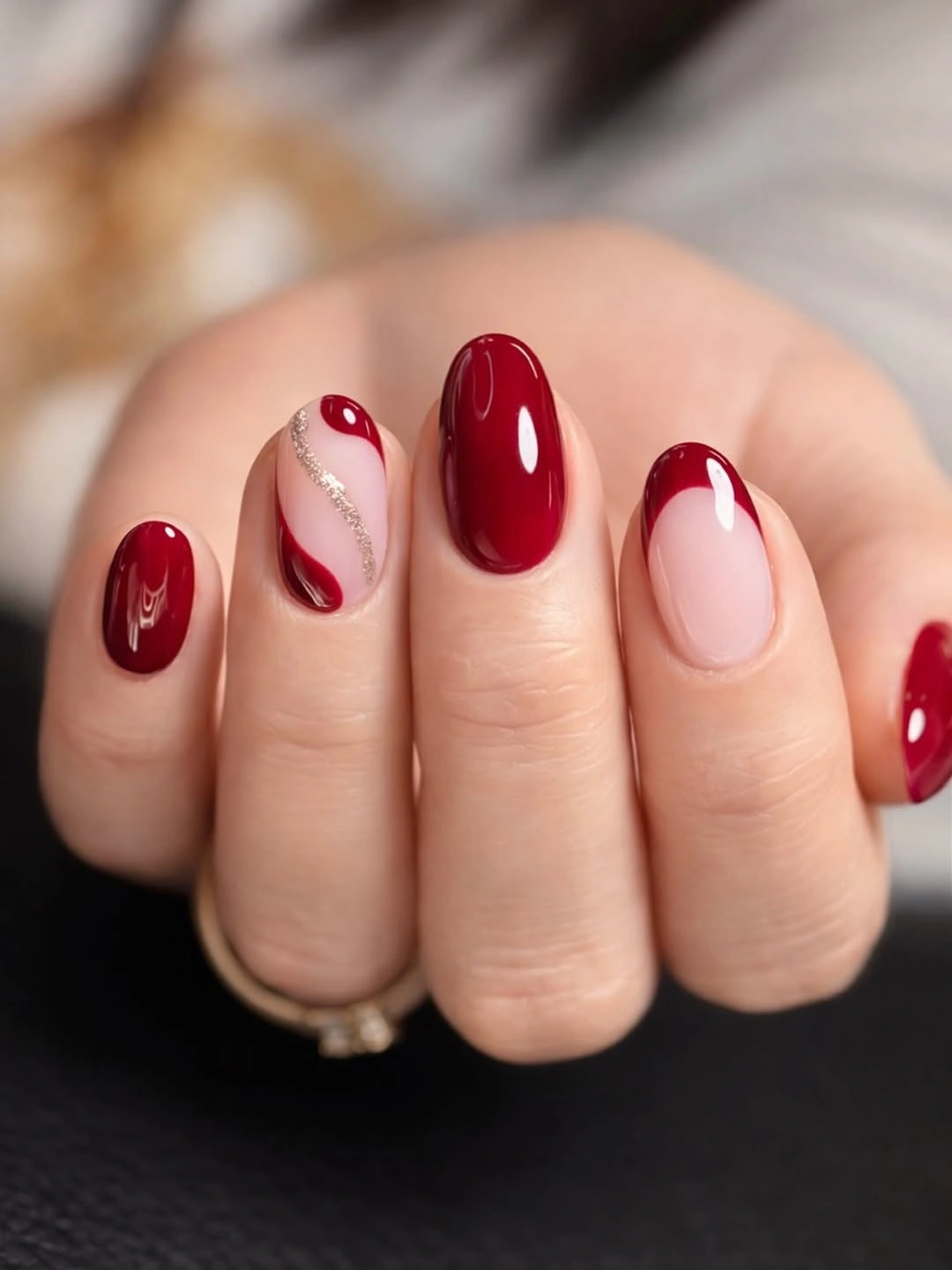 Short burgundy nails with silver wave accent