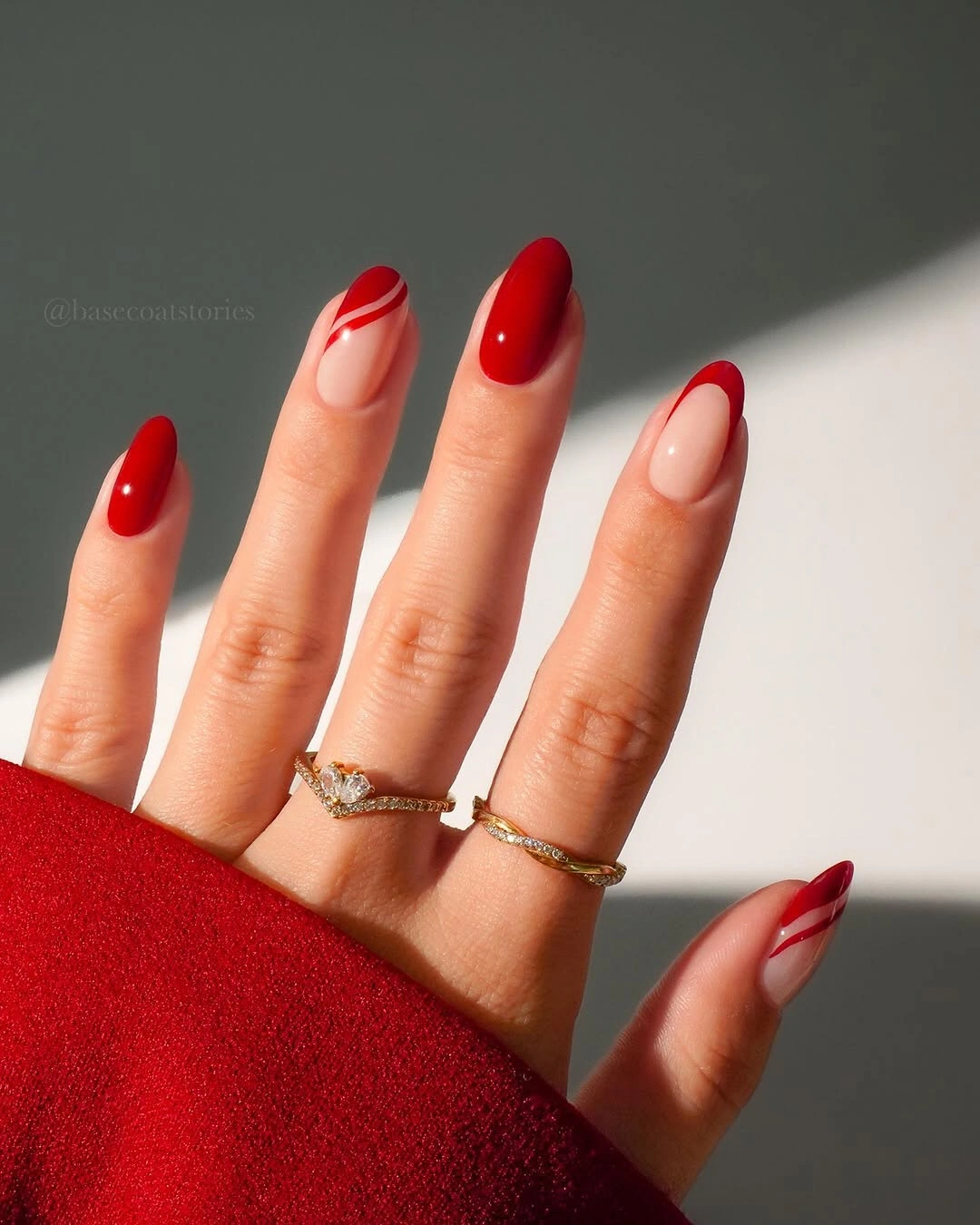 Red almond nails with curved negative space tips