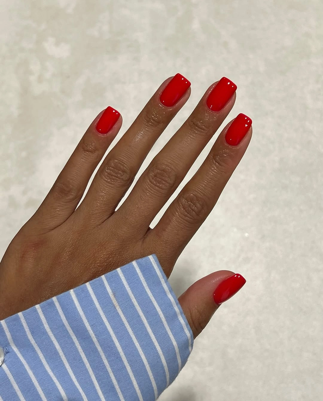 Short red square nails with clean glossy shape