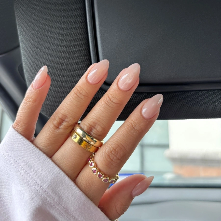 Short almond nails with a soft blush base and pale tips