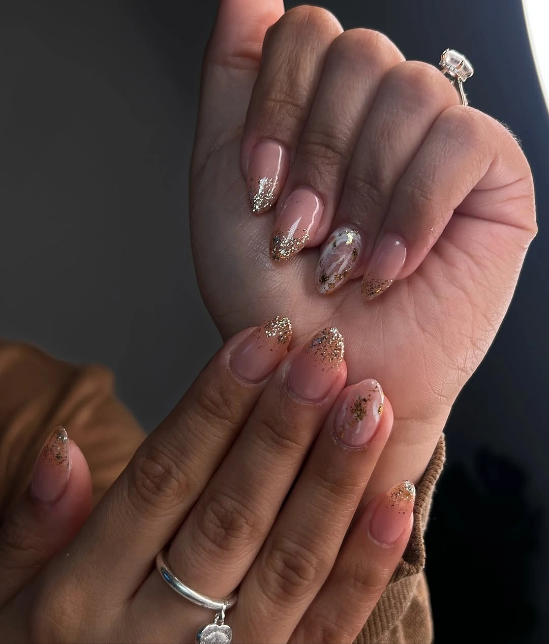 Sheer rose short almond nails with champagne-like accents