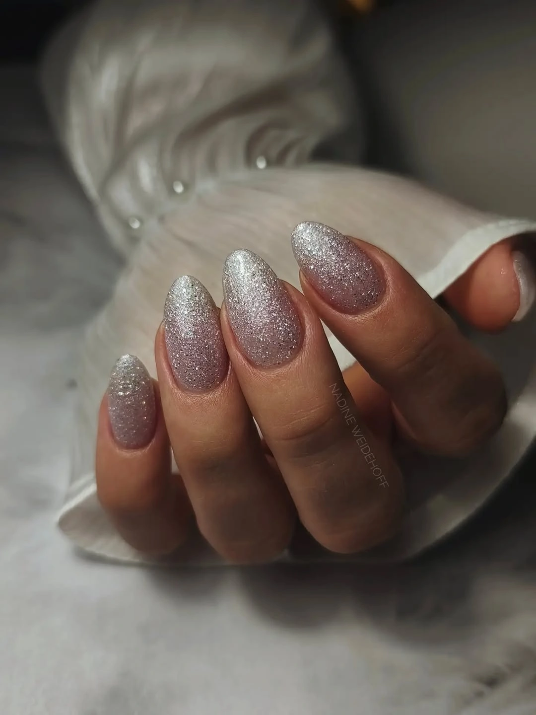 Short almond nails in cool silvery taupe shimmer