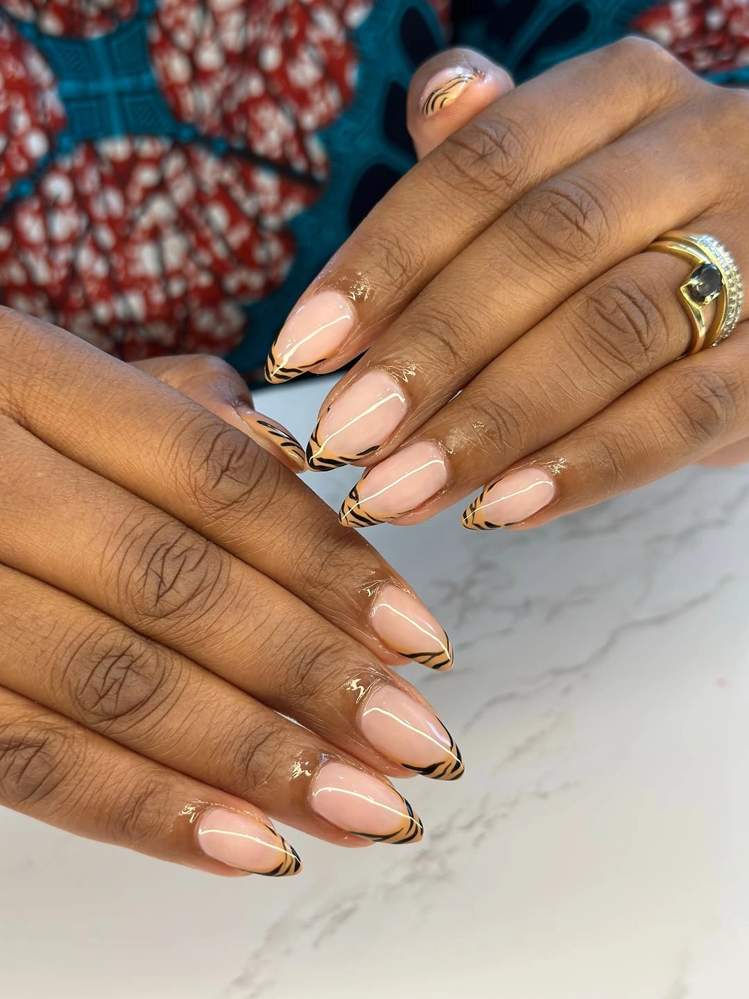 Nude pink short almond nails with fine warm outlined tips