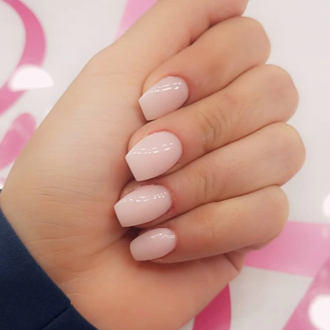 Short rounded square nails in glossy milky pink white color