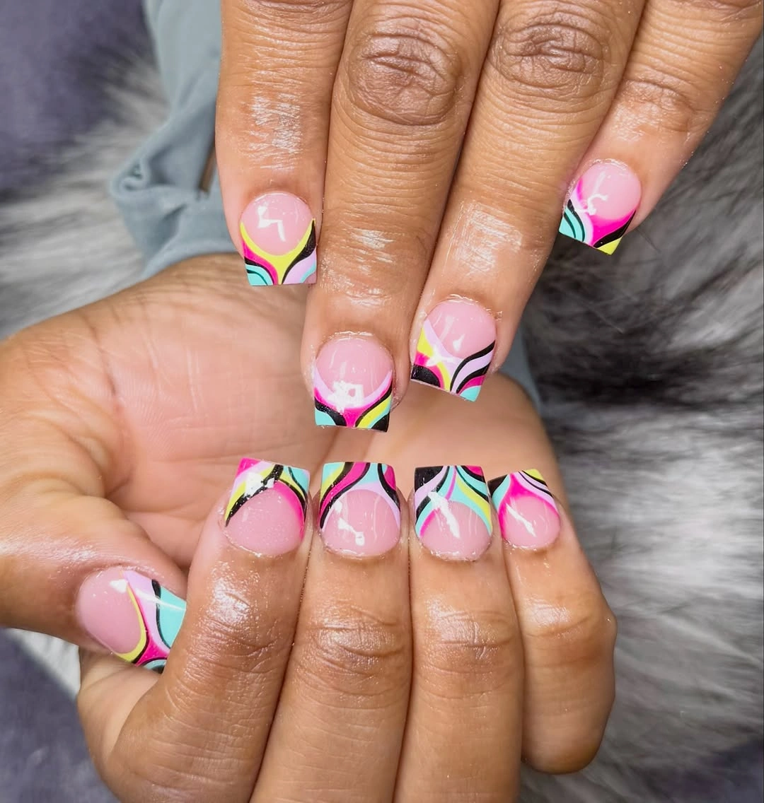 Short pink square nails with turquoise yellow and coral wavy tips