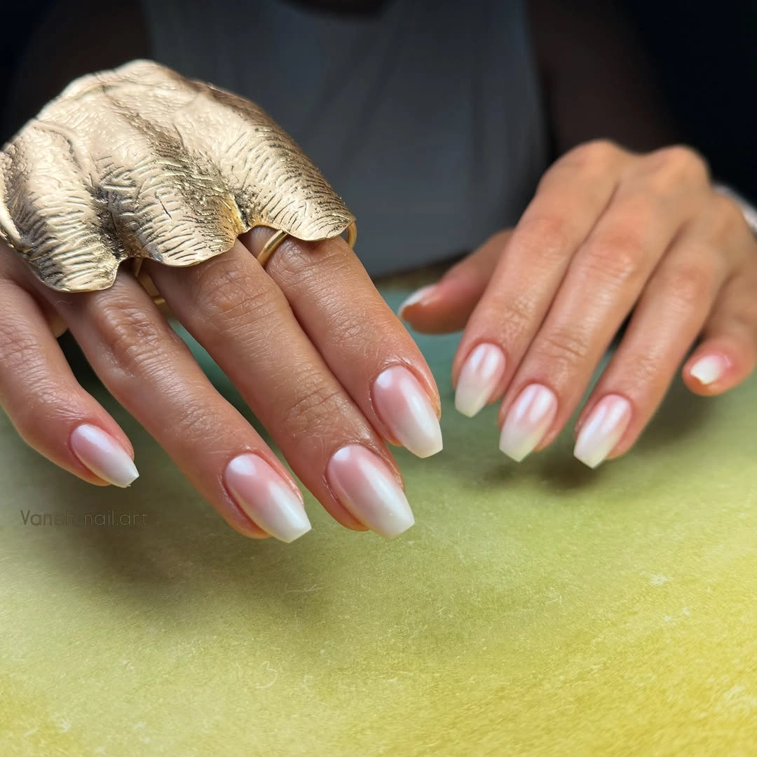 Medium almond nails with translucent pink and pale green French edges