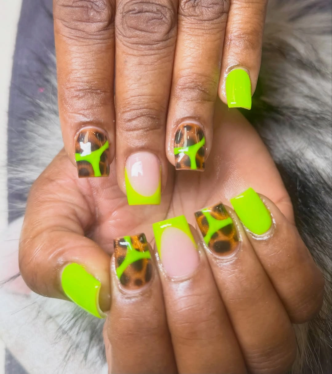 Neon green short square nails with brown spotted accent panels