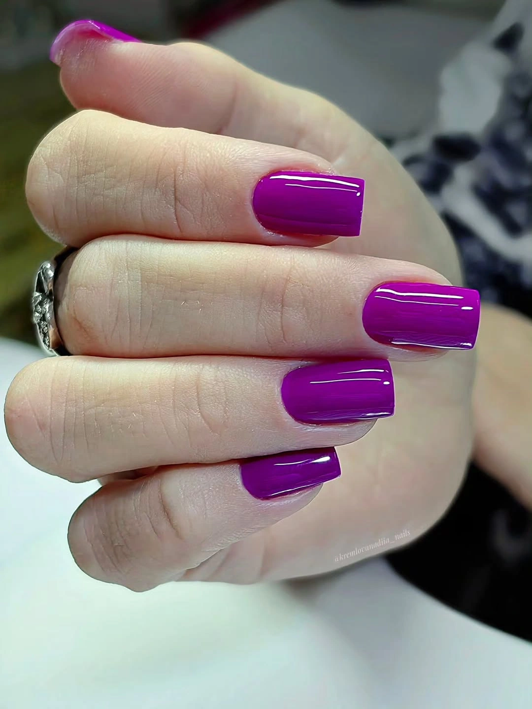 Long square nails in a glossy vivid fuchsia purple shade
