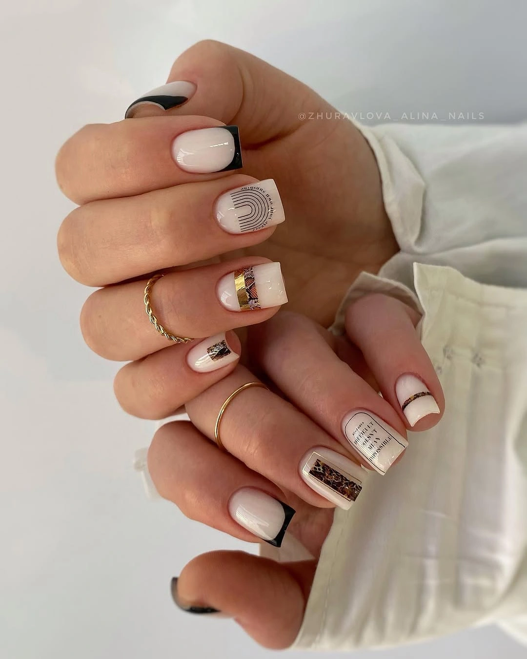 Medium square nails in off-white blush black and brown with sparse graphic lines