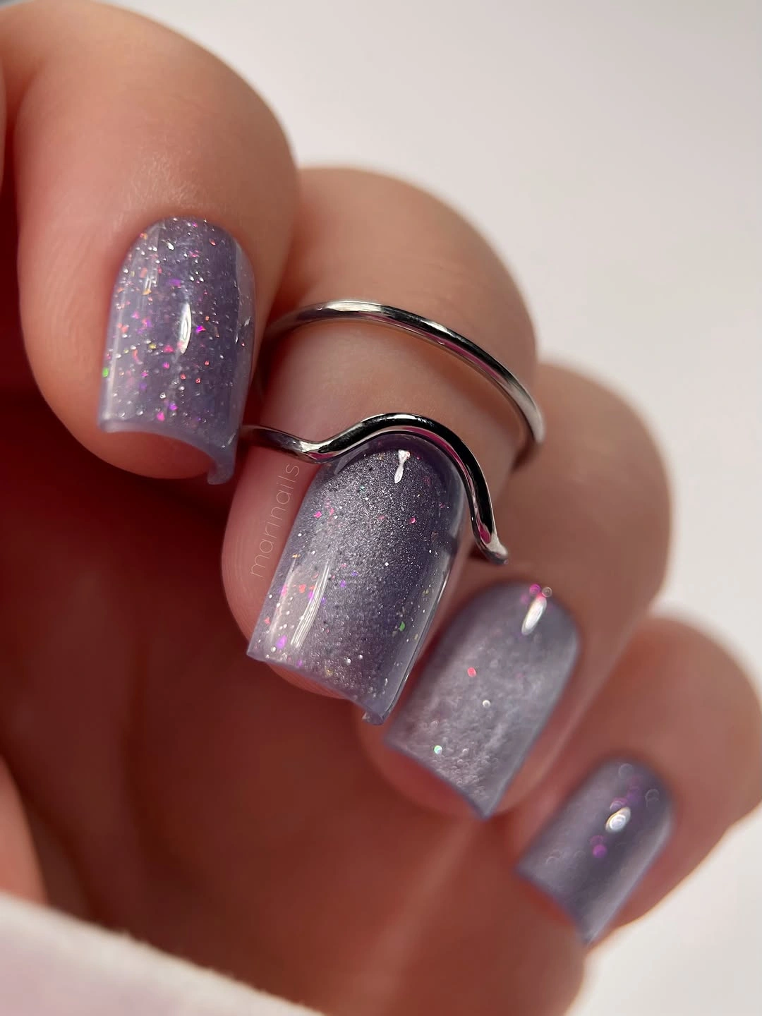 Long square lavender-gray nails with a soft reflective-looking finish