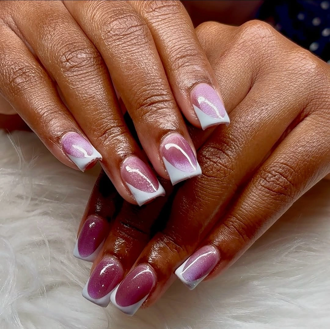 Pink and purple medium square nails with pale curved shapes and abstract swirls