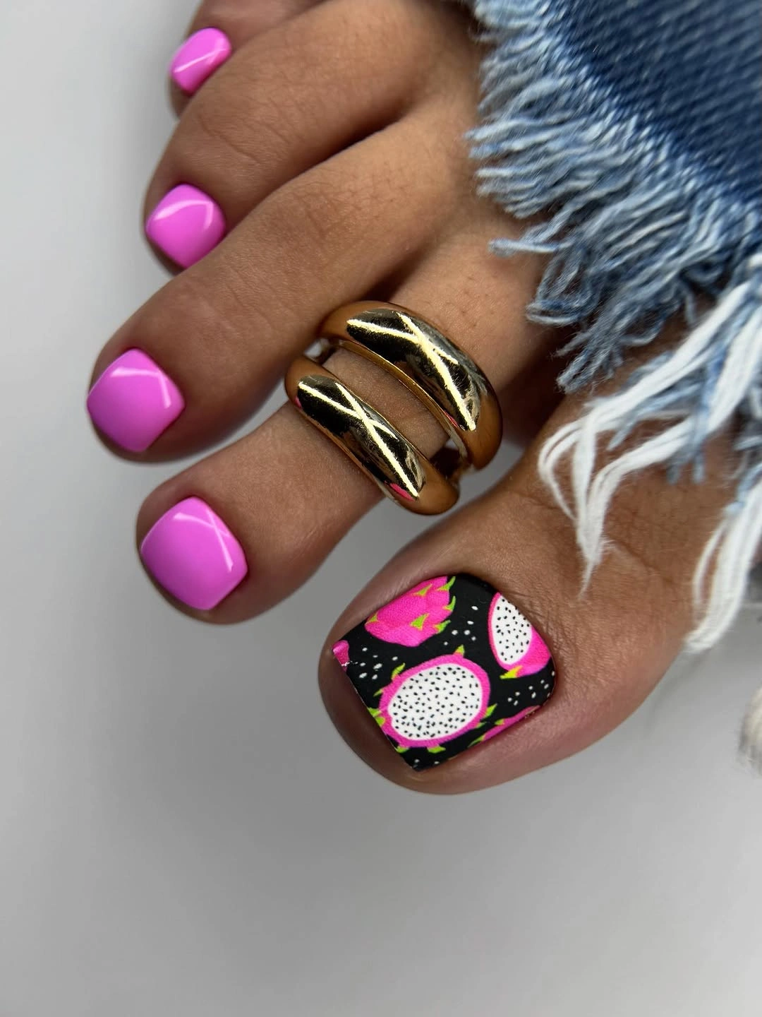 Hot pink toes with a graphic decorated big toe accent