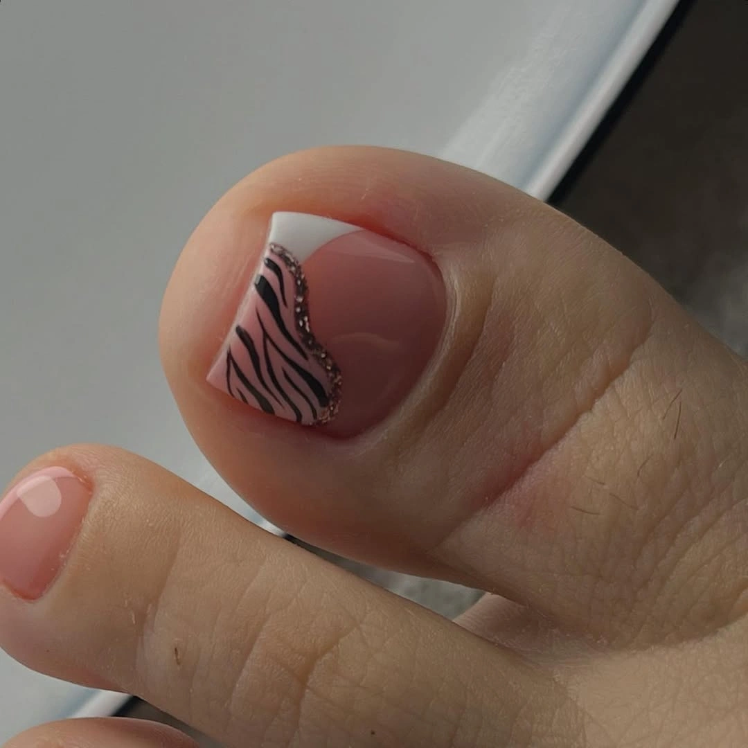 Sheer nude pink toes with one small dark abstract accent