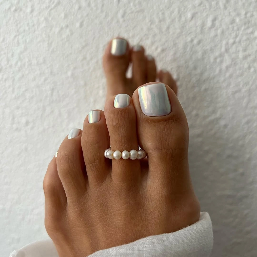 Pale silver metallic toes with smooth reflective shine