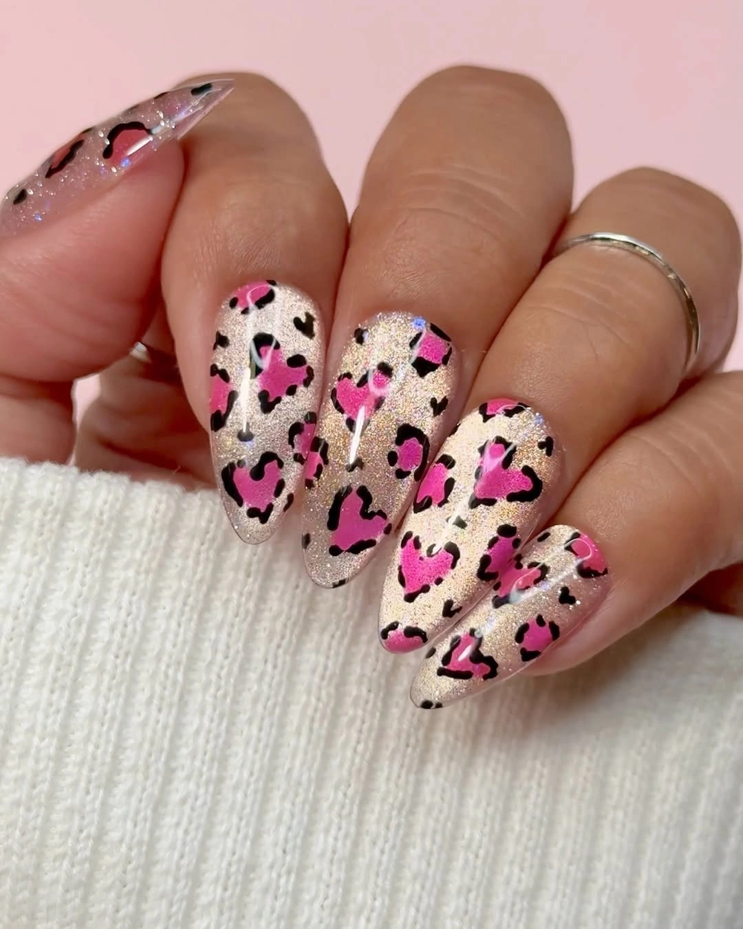 Long almond nails with pink black and pale spotted print