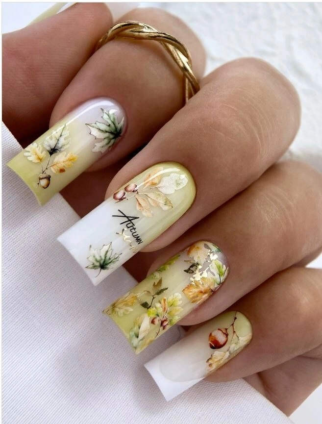 Long milky square nails with delicate yellow green botanical details