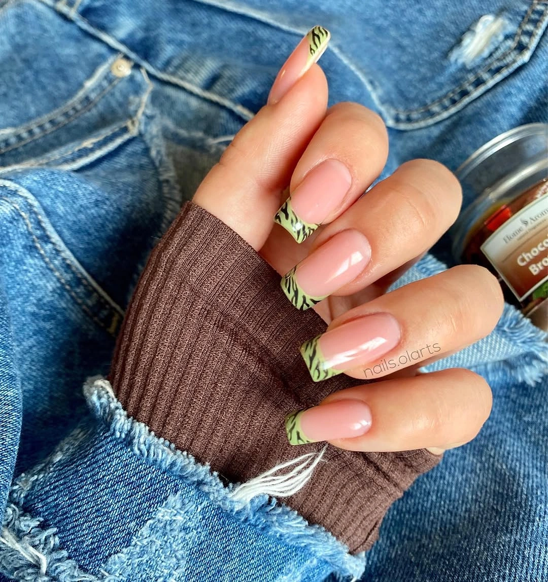 Medium almond pink nails with green and gold pointed accent