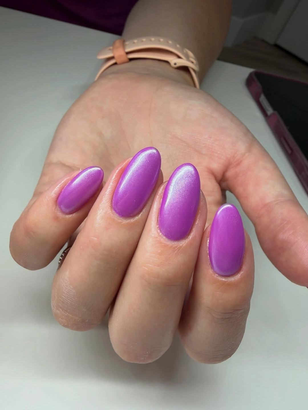 Glossy saturated purple nails with rounded square edges