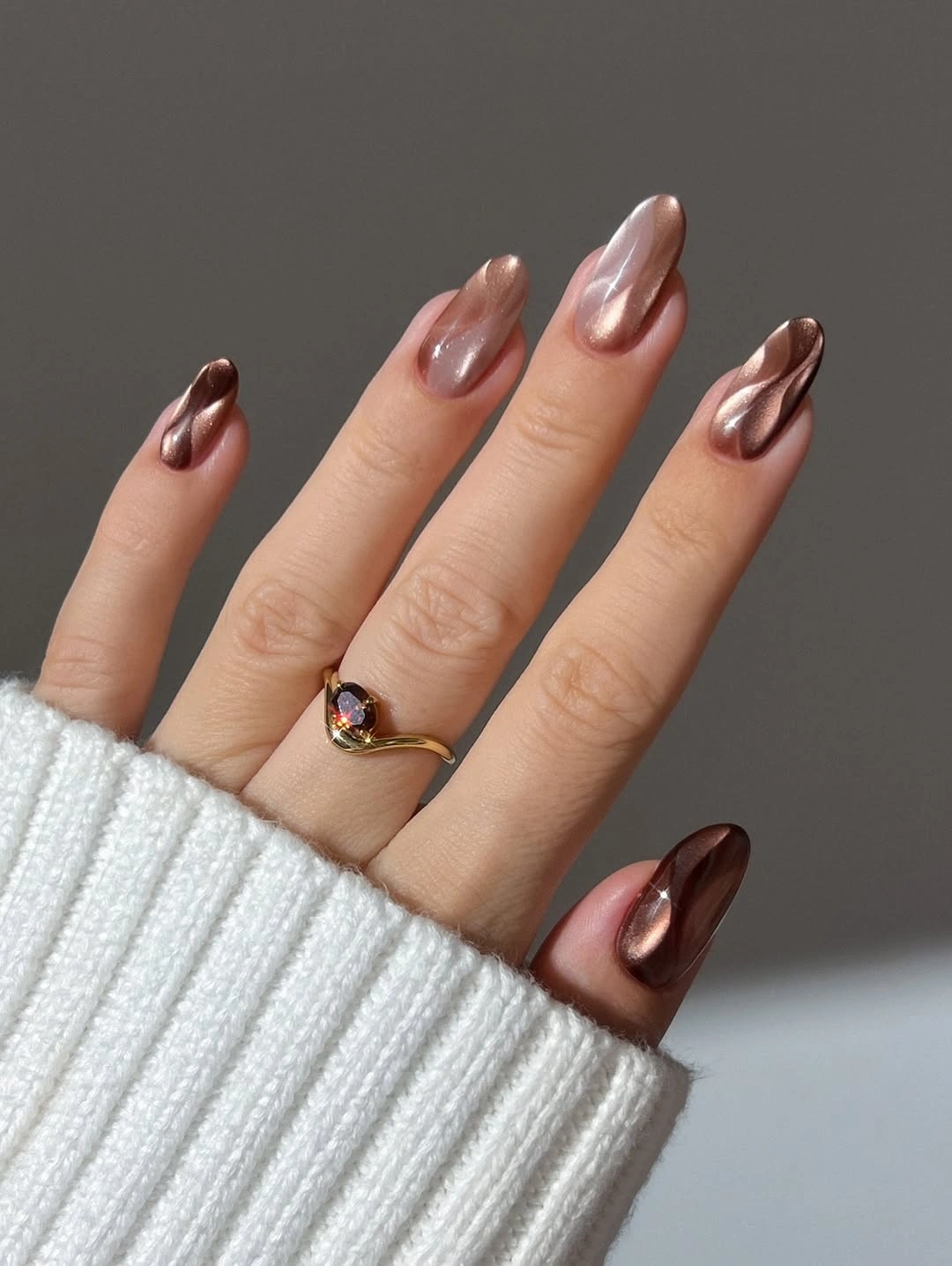 Chocolate brown almond nails with champagne diagonal shimmer