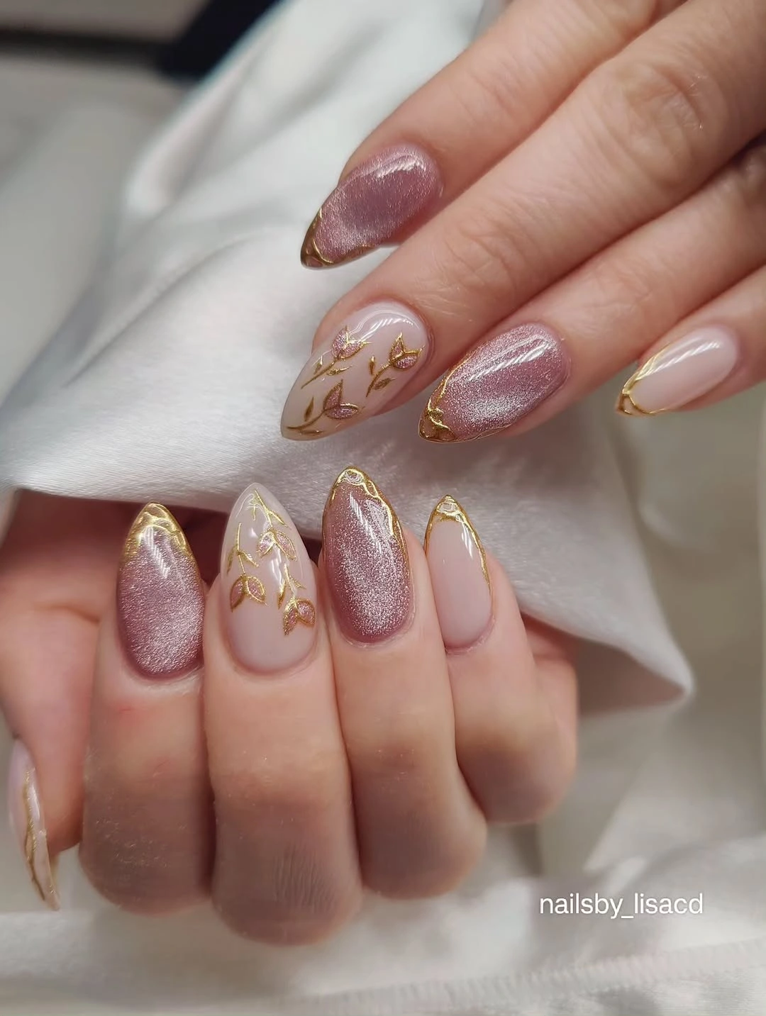 Mauve shimmer almond nails with sheer gold vine accents