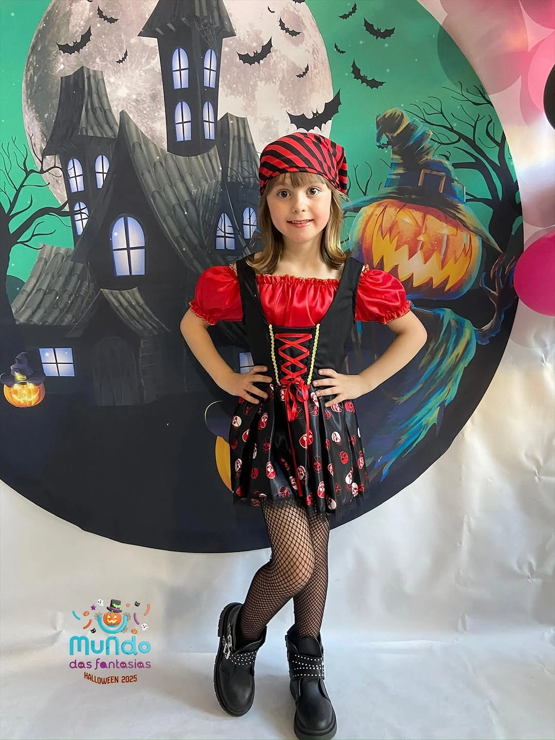 Child pirate costume with red head scarf, black corset front, boots, and fishnets