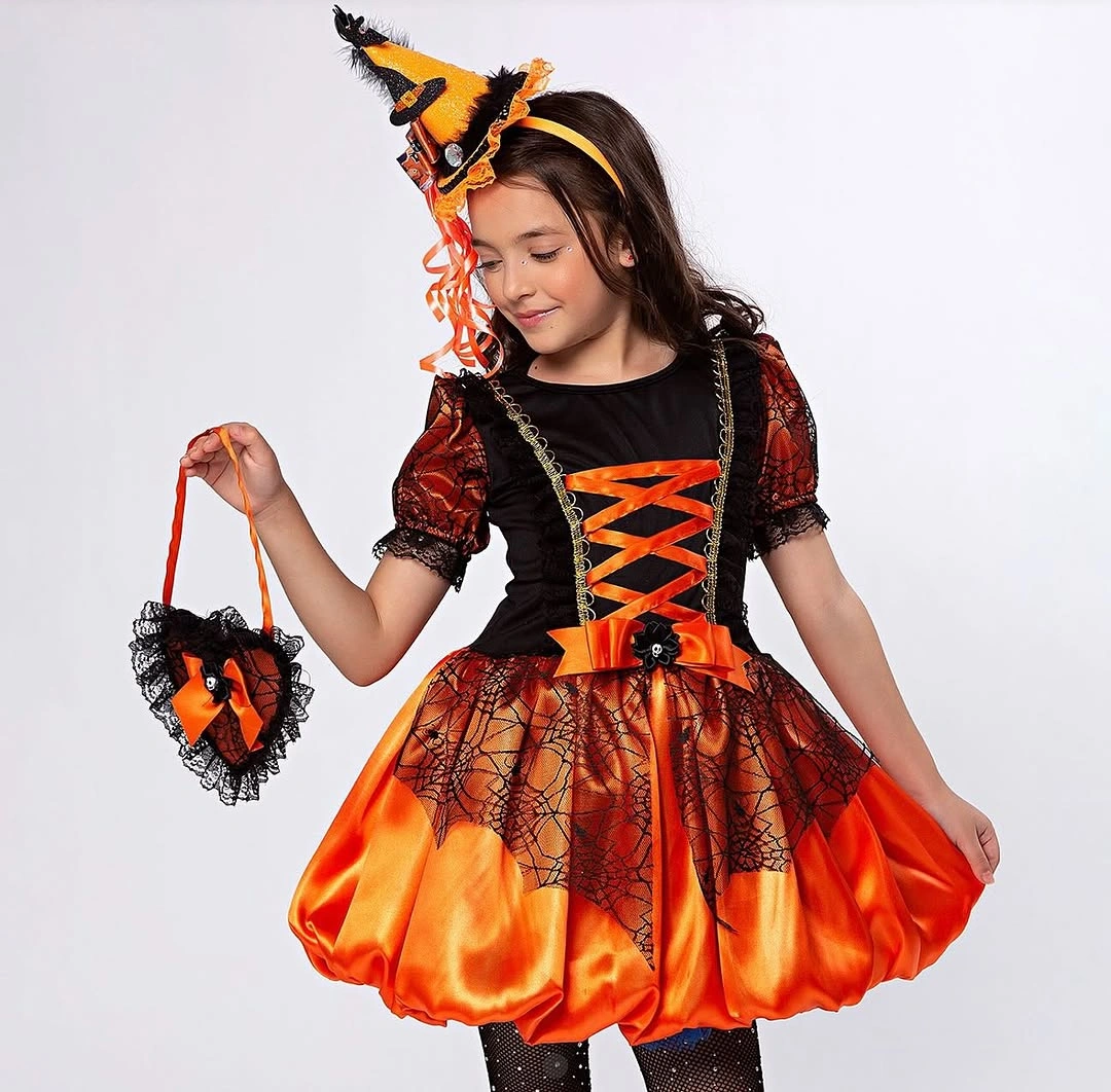 Child in orange-and-black witch costume with lace-up bodice and hat