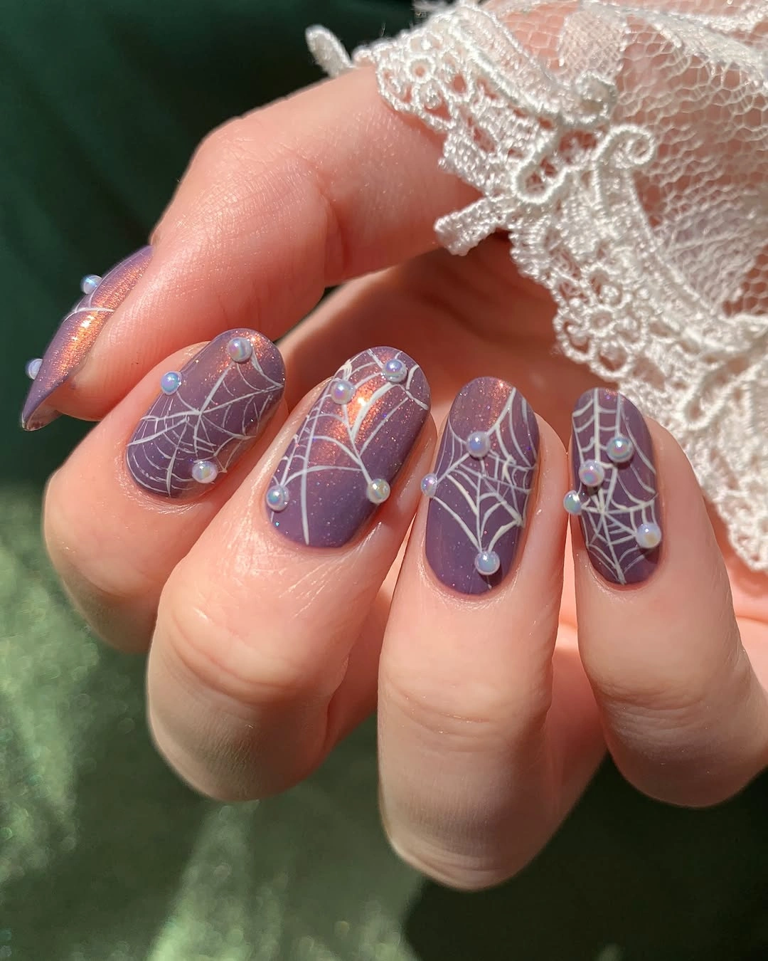 Dusty purple square nails with white webs and silver accents