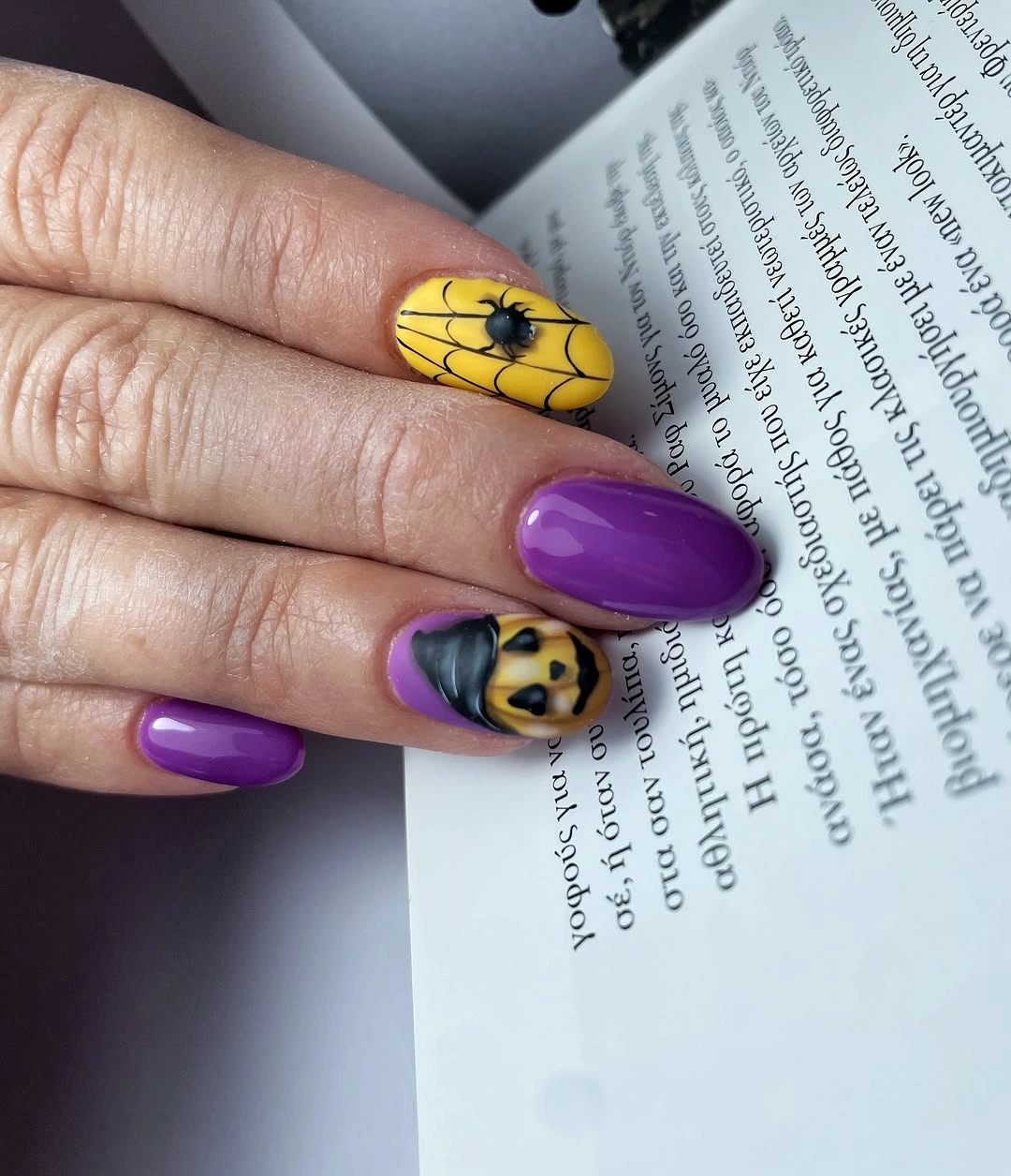 Purple almond nails with yellow web lines and small accents