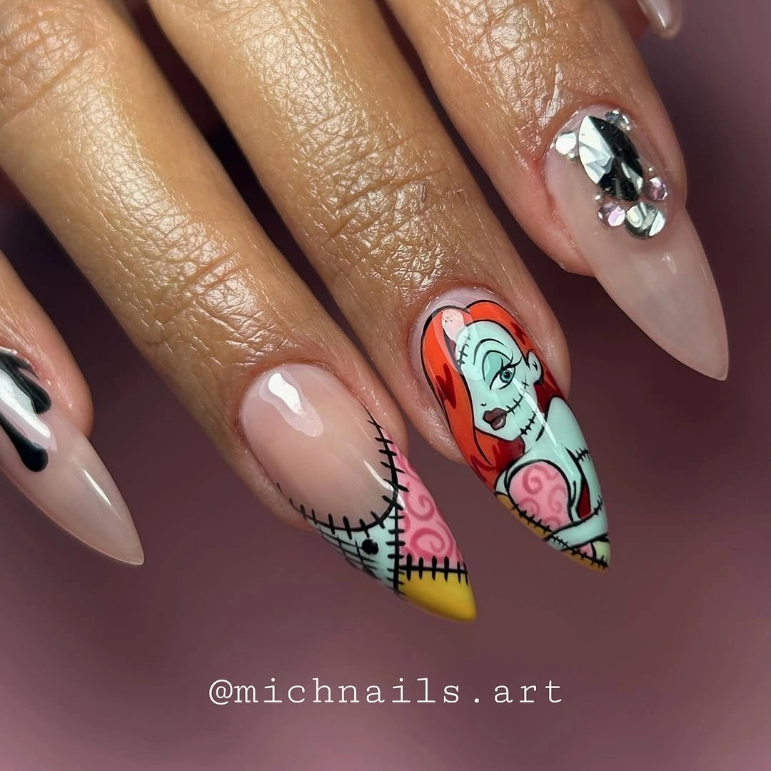 Long almond nails with stitched patches and colorful character art