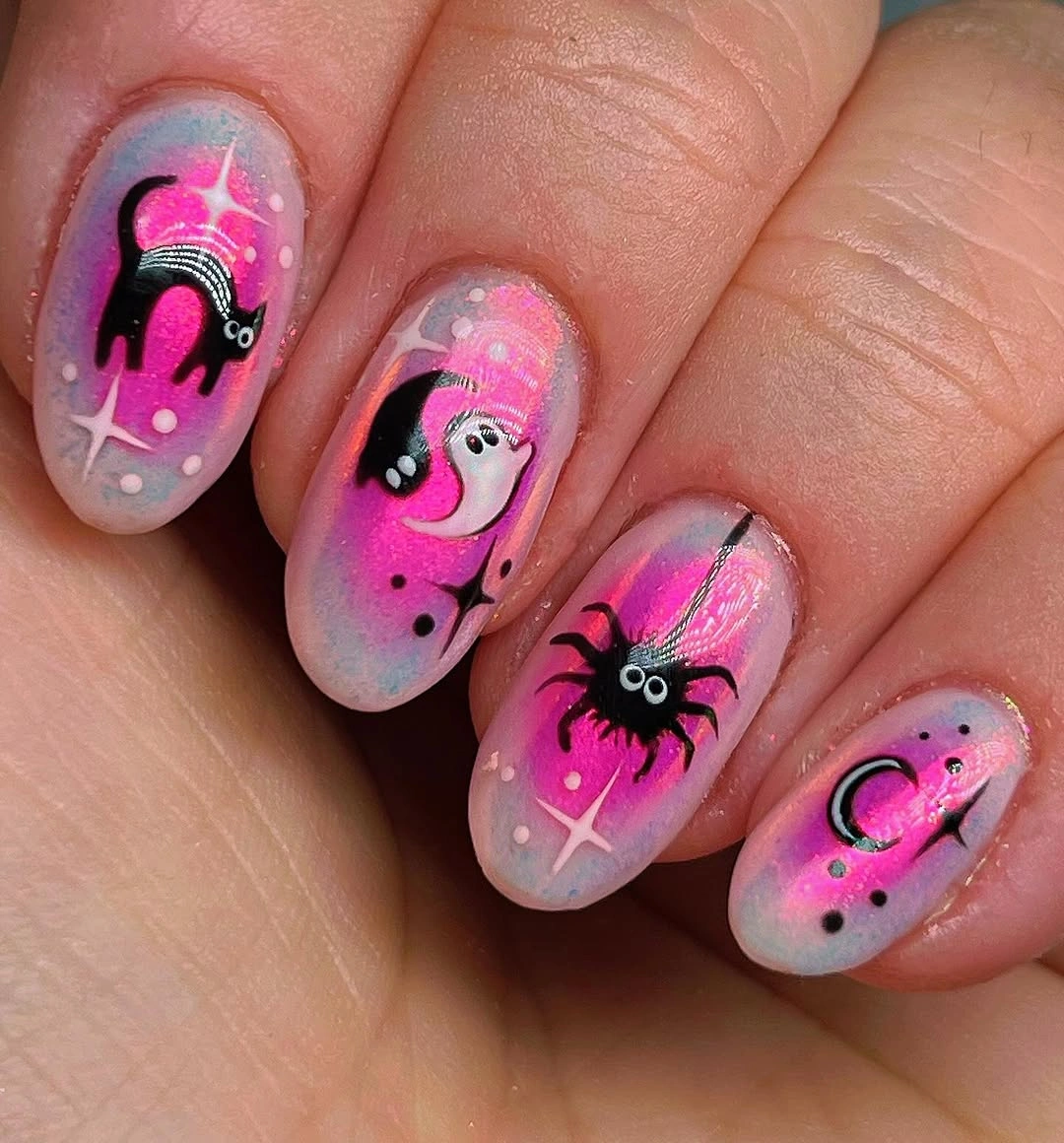 Lavender oval nails with bats, ghost, spider, and moon details