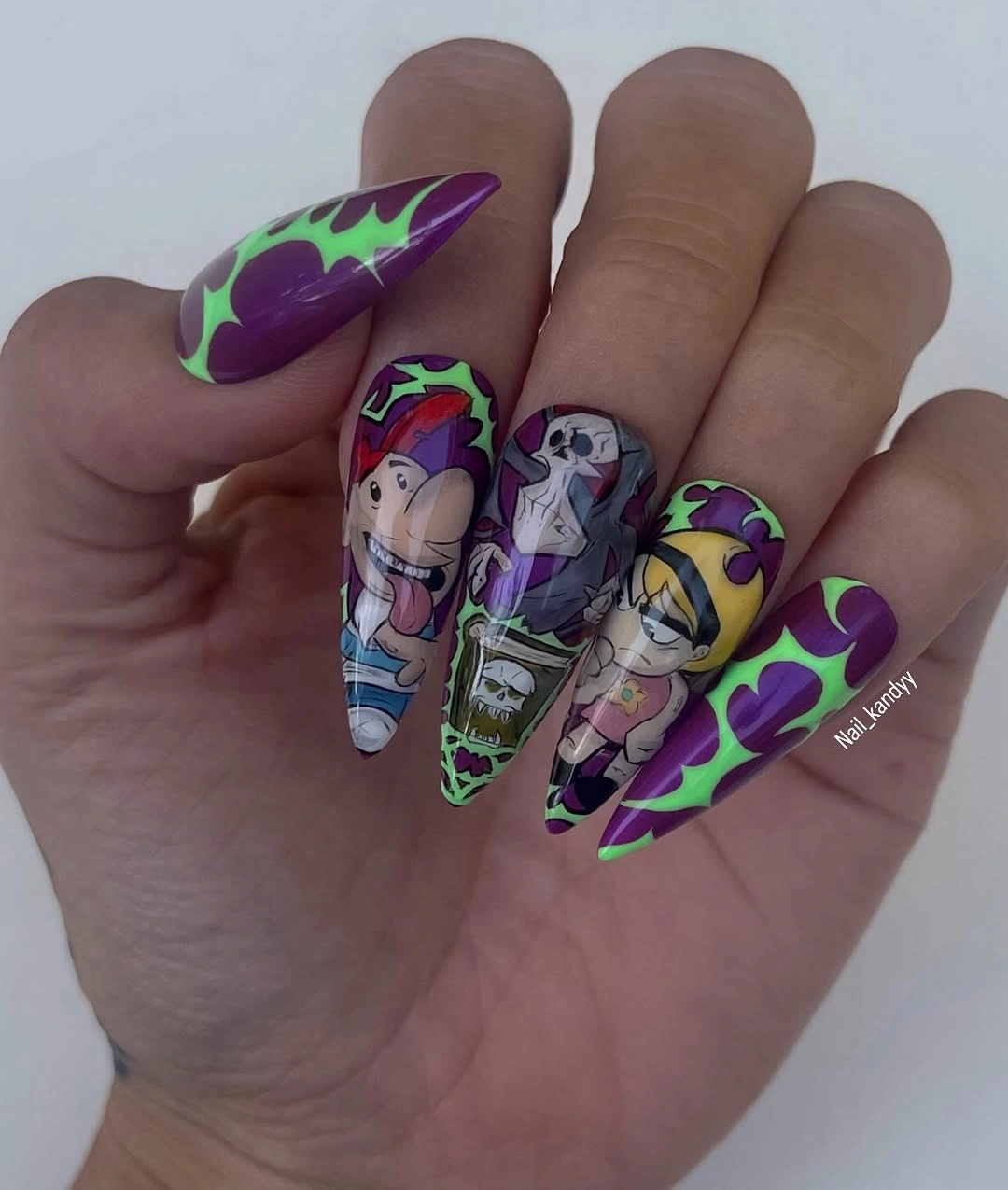 Neon purple stiletto nails with slime borders and cartoon panels