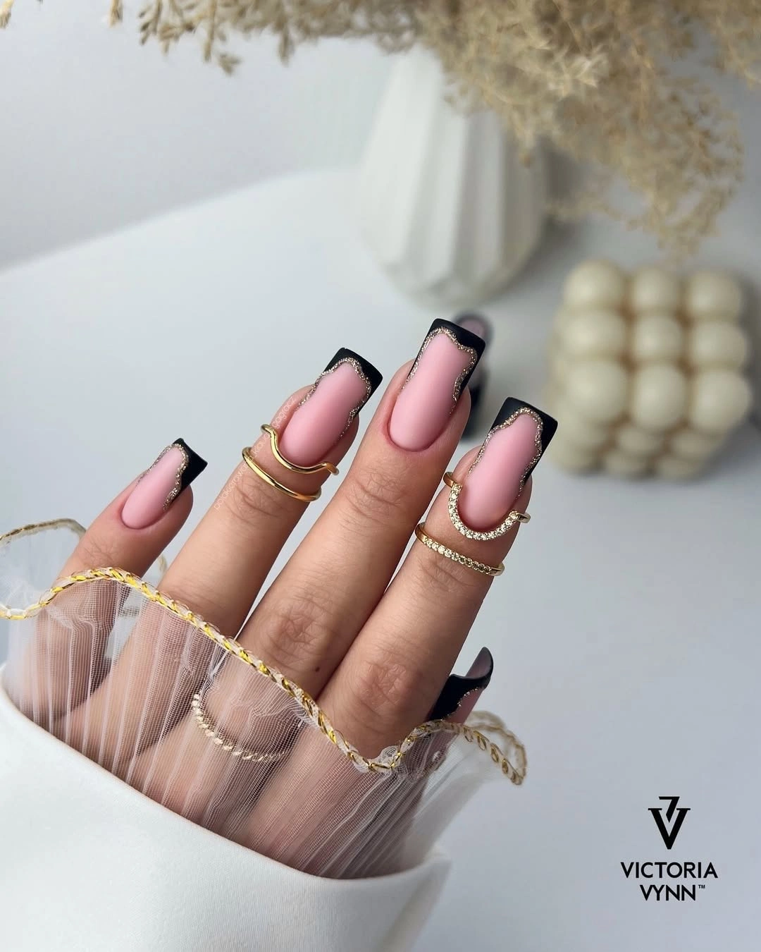 long baby pink square nails with sharply framed black French tips