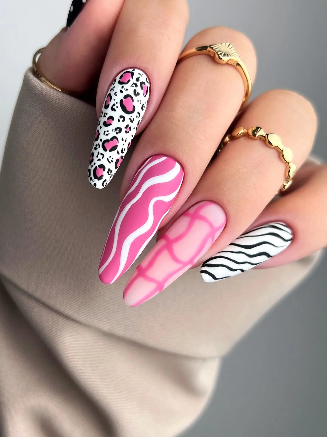 long pink square nails with zebra stripes and pink leopard-print accents