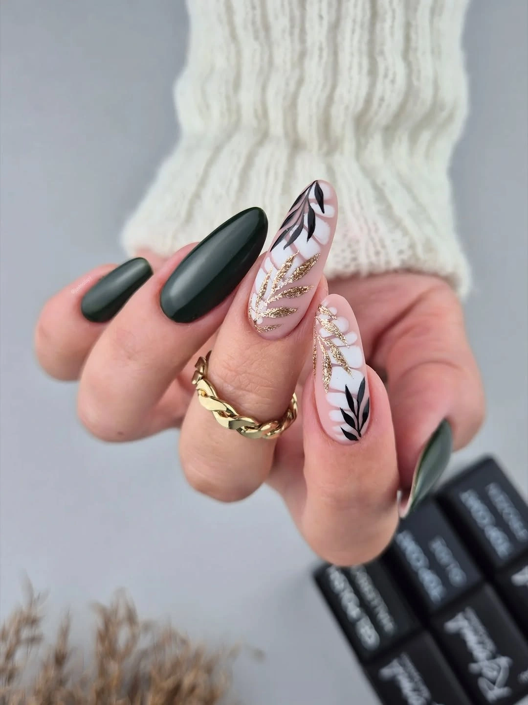matte forest green and blush almond nails with black botanical accents