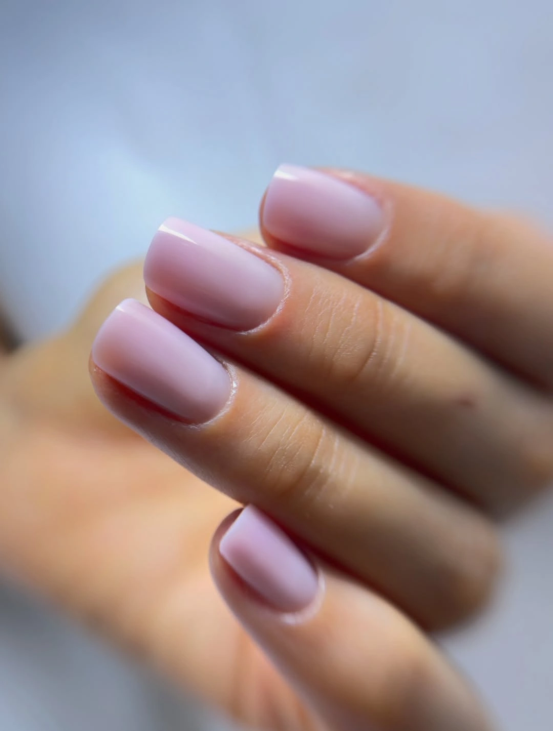 Short square nails in a smooth glossy muted lilac shade