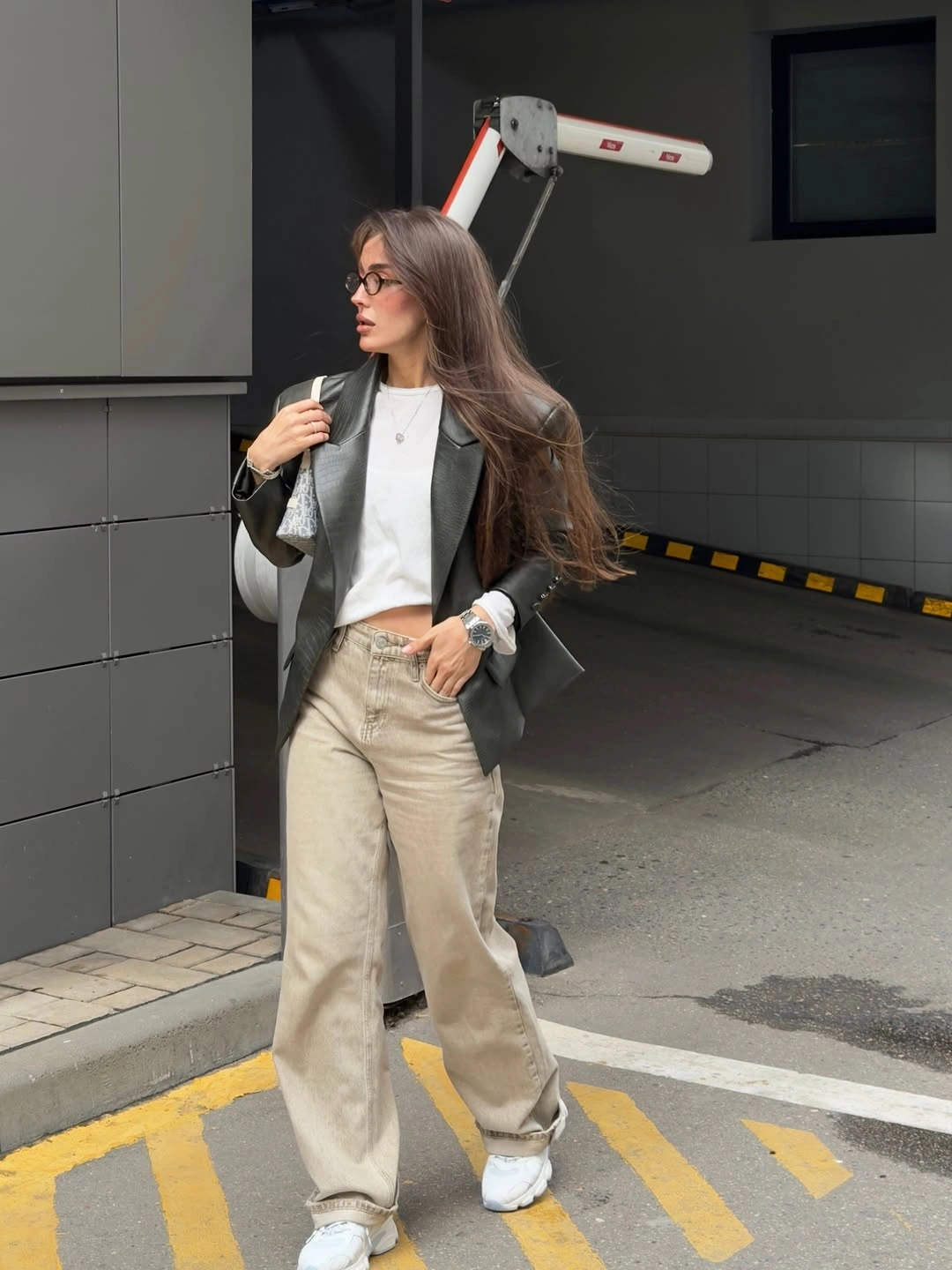 Gray overshirt with white tee beige loose jeans and trainers