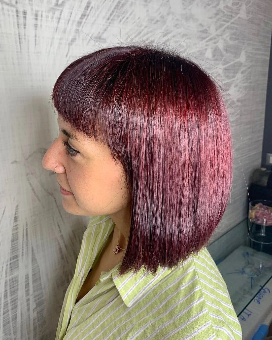 Smooth berry red bob with straight blunt fringe