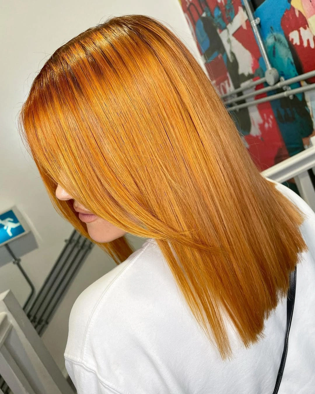 Smooth golden copper long hair with darker root depth