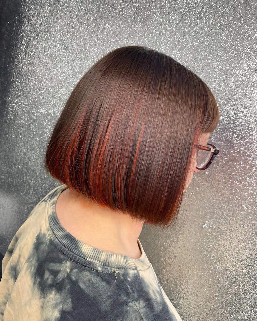 Dark brown bob with fine red accent lines