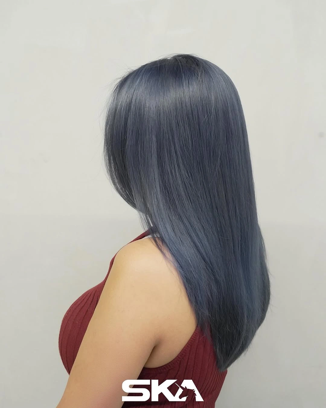Long sleek blue black hair with cool reflective sheen