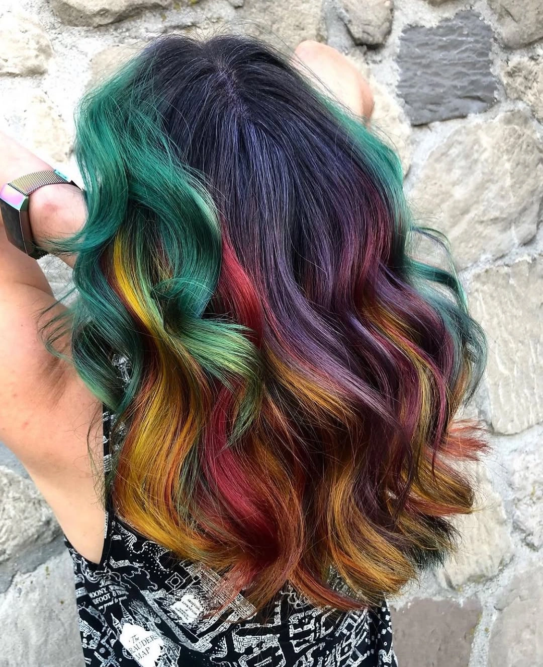 Dark wavy hair with teal purple red and gold ribbons