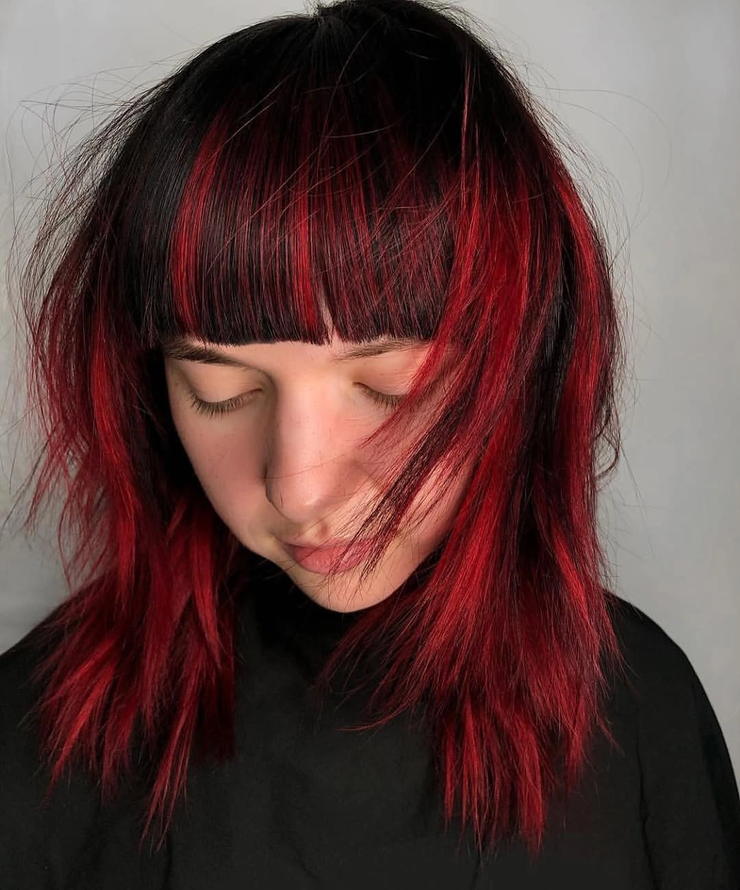 Black medium shag with blunt fringe and red panels