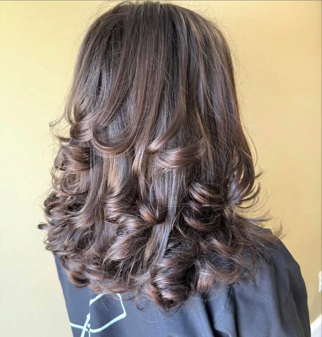 Long brunette hair with smooth crown and curled layered ends