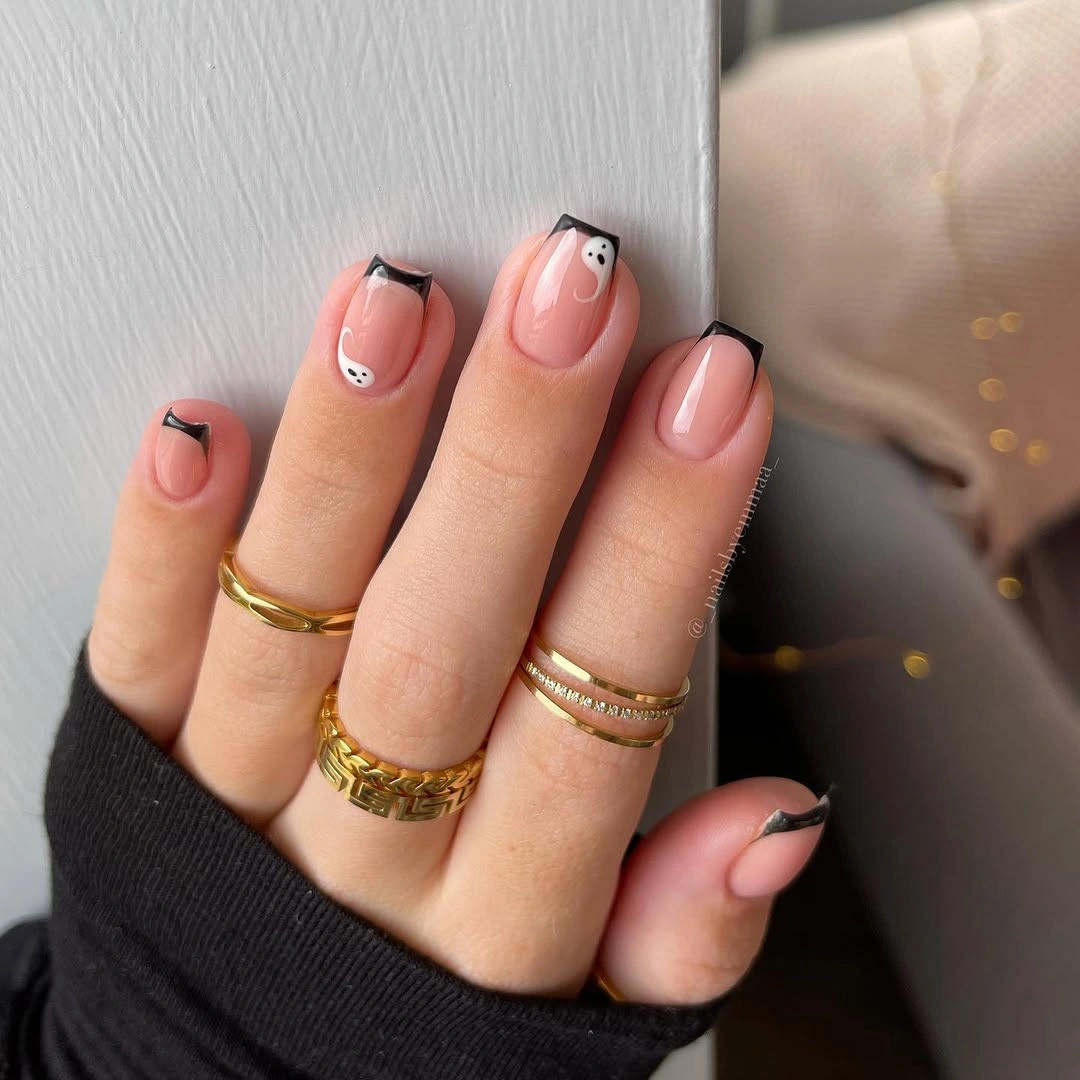 Pale pink nails with orange angled tips and gray green details