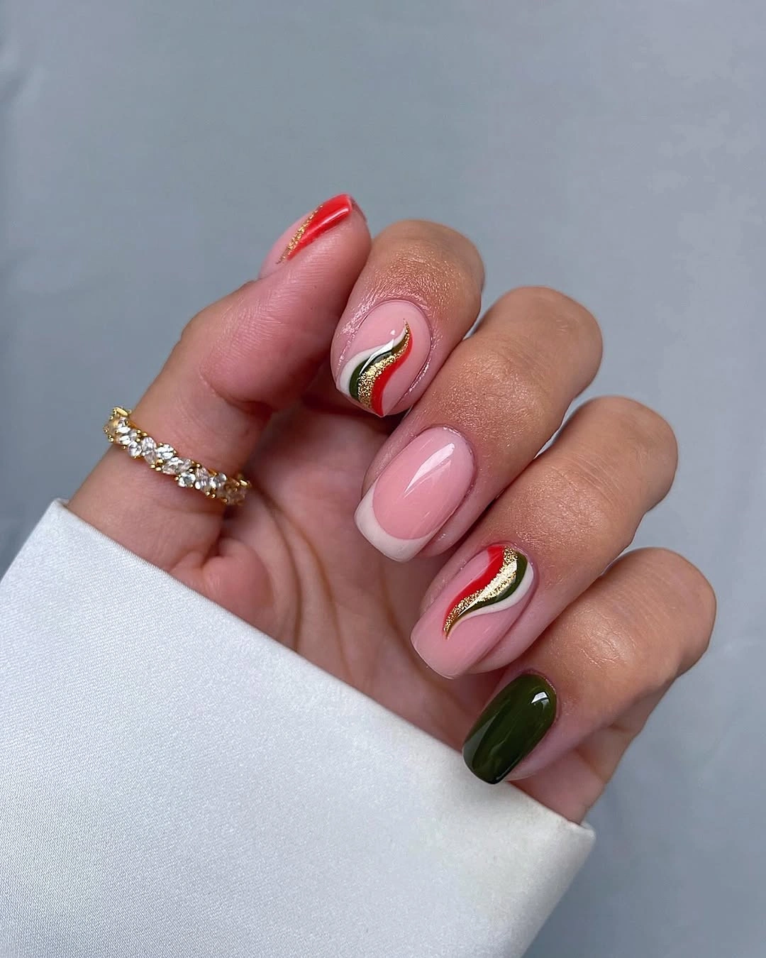 Pale pink olive green nails with tiny berry leaf details