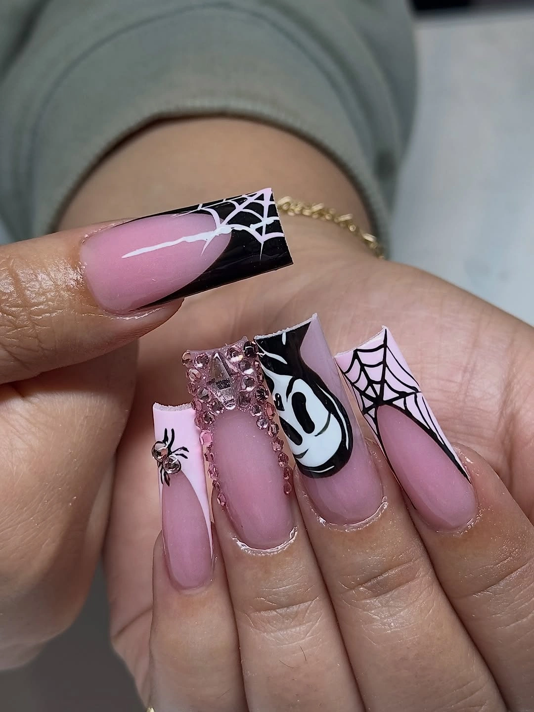Lavender pink square nails with black spiderweb graphic details