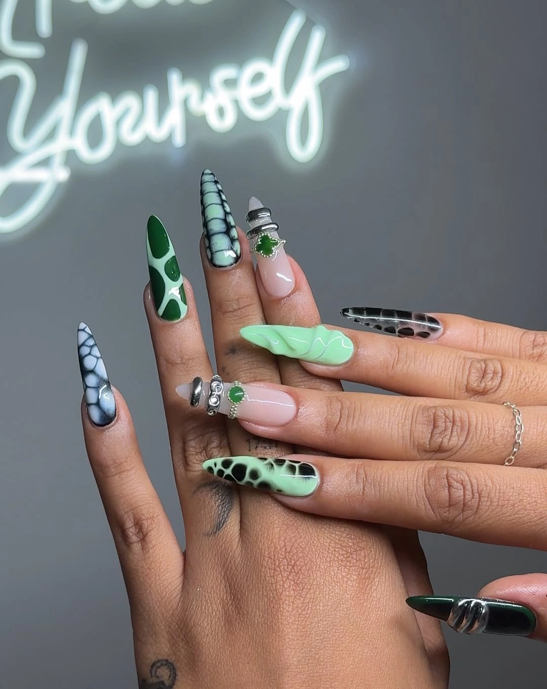 Long almond mint pink and black white graphic nails